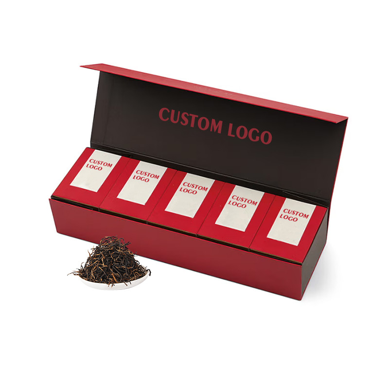 Red luxury tea sampler presentation box with five individual tea cartons aligned in one row
