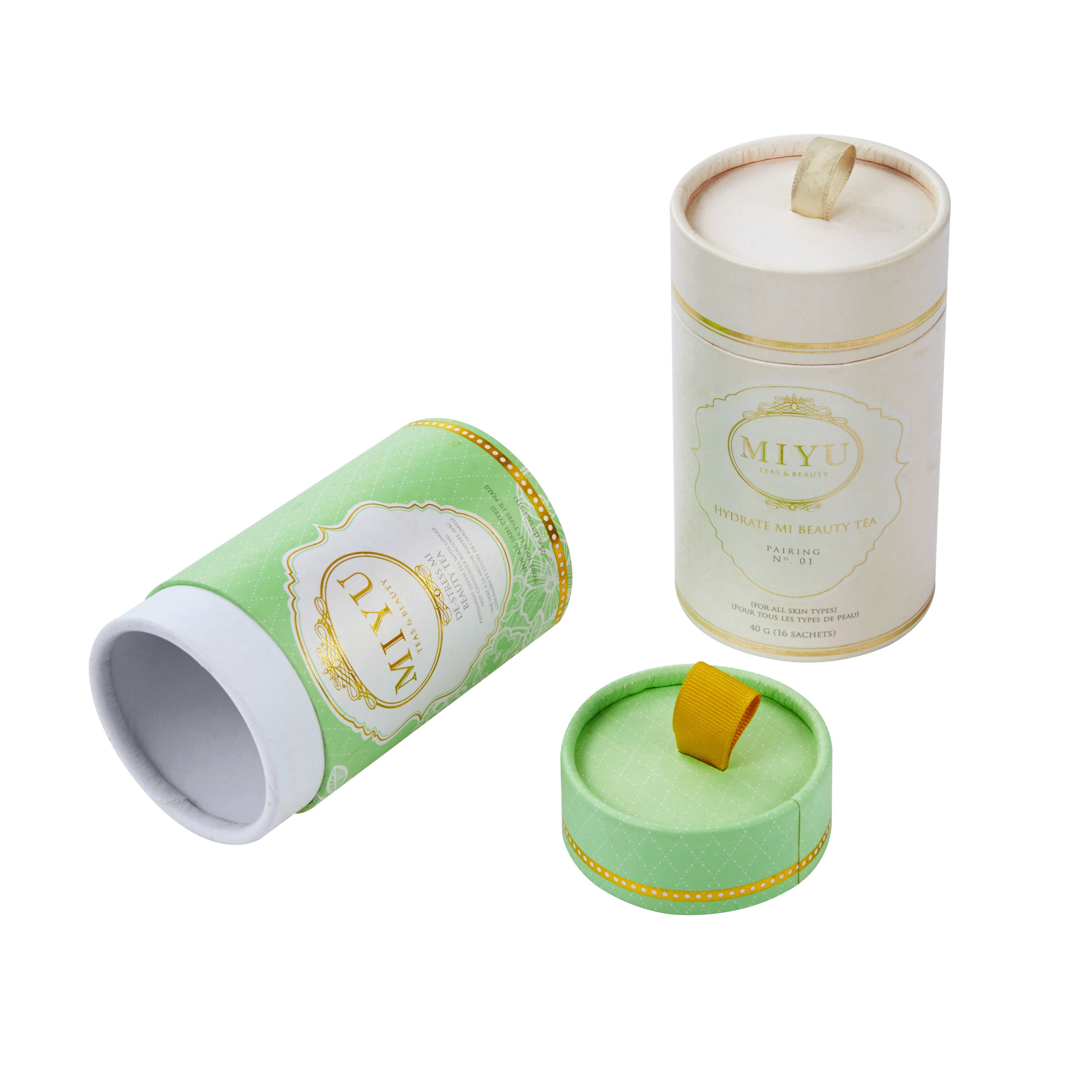 Luxury tea tube packaging with decorative gold accents