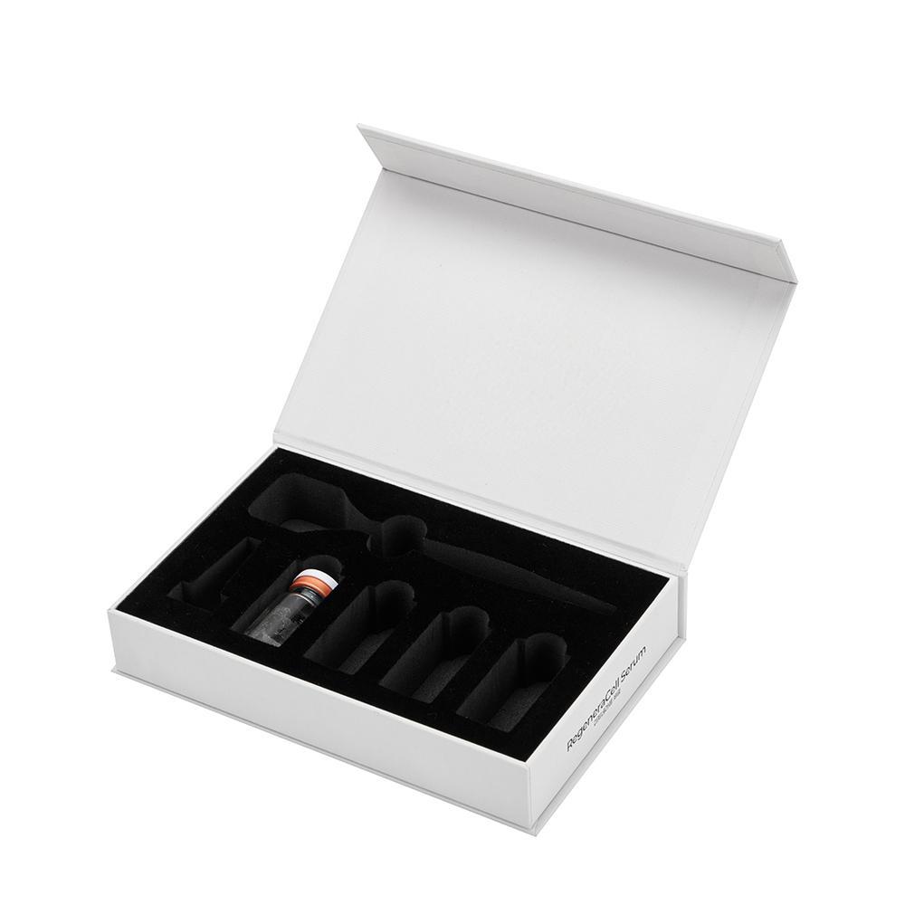 Open magnetic peptide vial packaging box with black EVA foam slots and printed QR code
