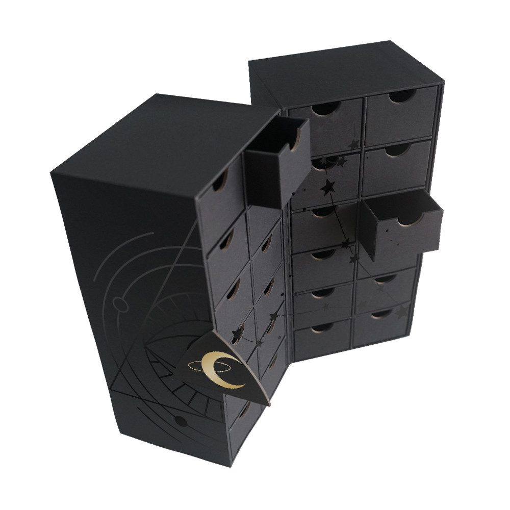 Open magnetic advent calendar box with 24 individual pull-out drawers