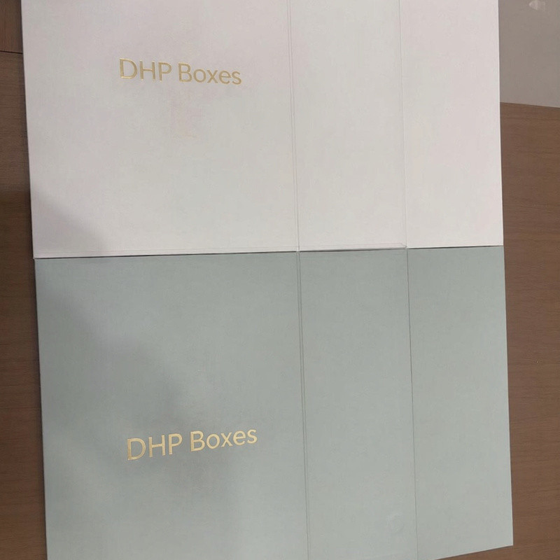 Close-up of gold foil stamping on a matte custom magnetic rigid gift box pre-production sample