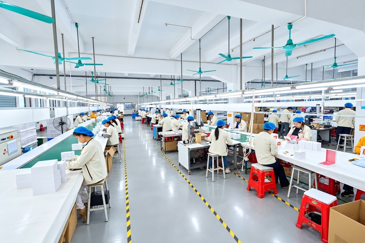 Custom rigid box manufacturing factory in China showing production equipment and finished luxury packaging boxes