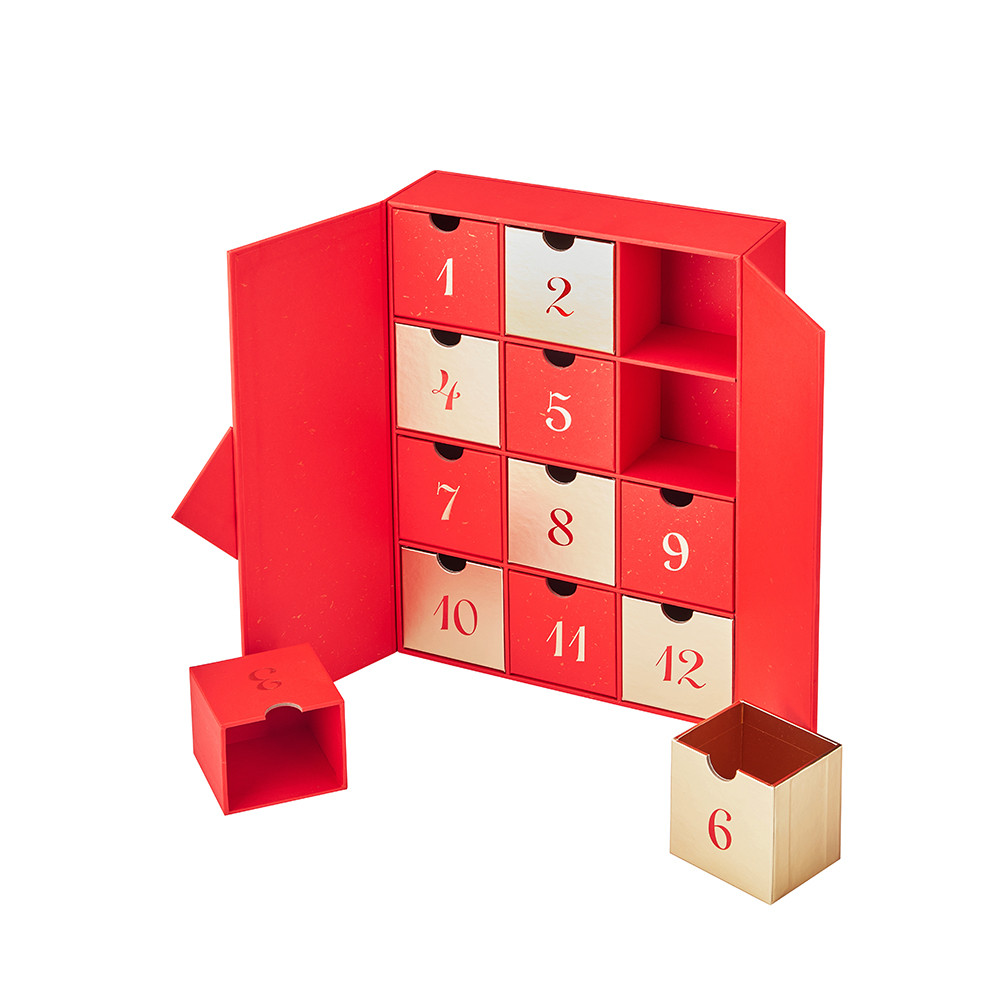 Open luxury Christmas advent calendar box with 12 removable red and gold rigid gift boxes