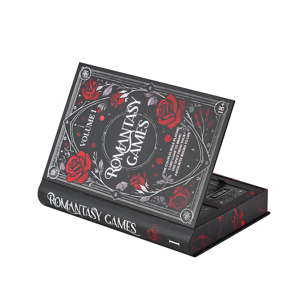 Angled view of a custom book-style rigid card game box with rounded spine and decorative printed artwork