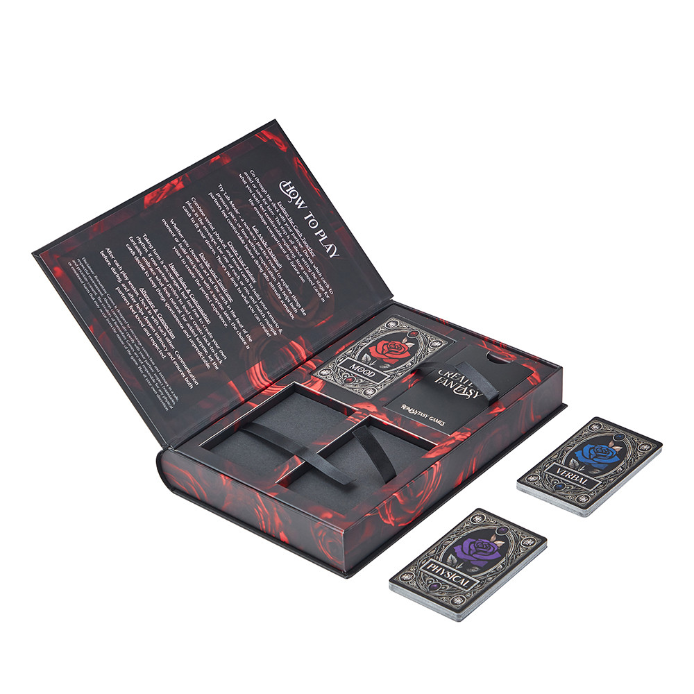Open book-style rigid card game box with magnetic closure, foam insert, paperboard dividers and multiple card decks