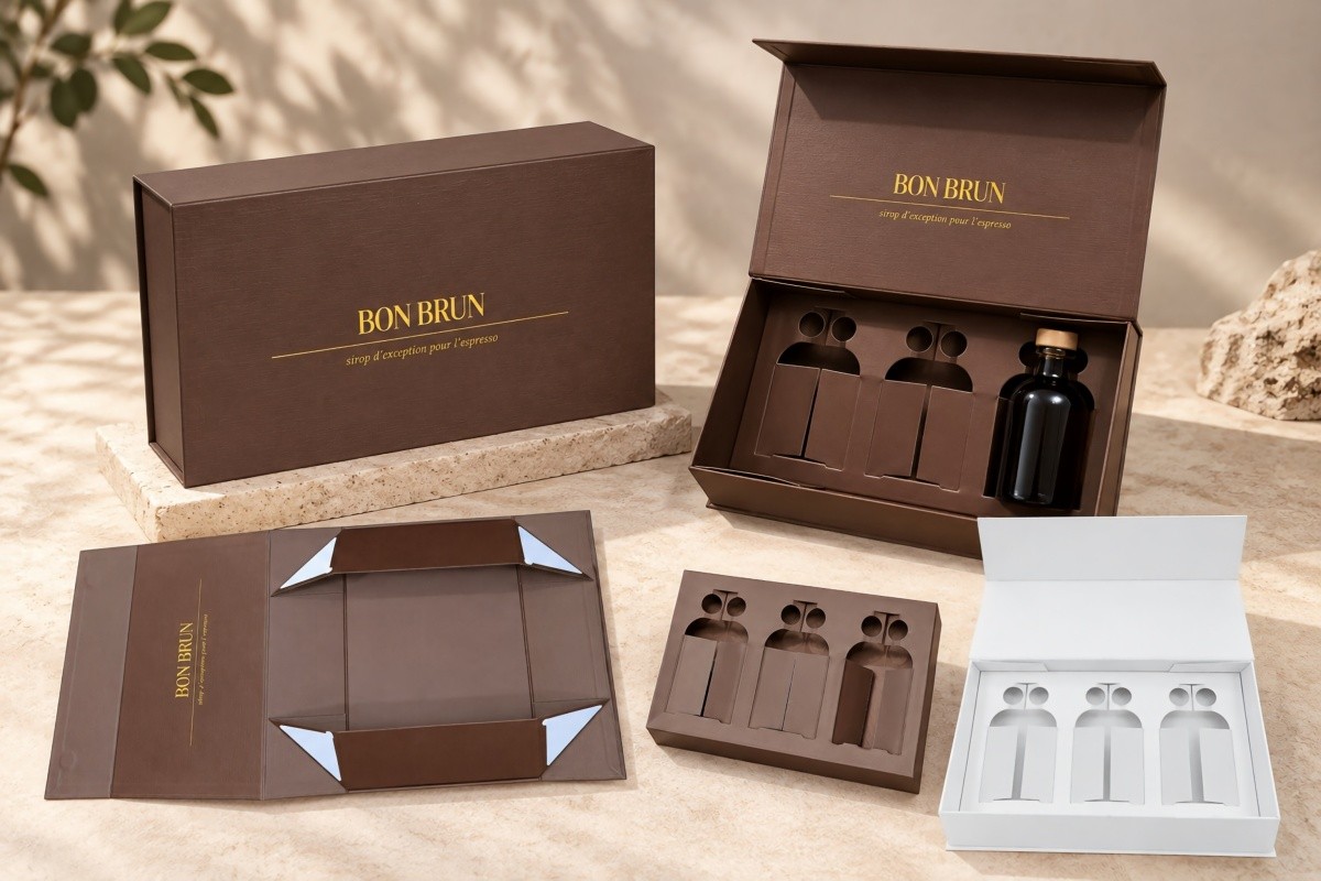 Brown three-bottle foldable magnetic liquor gift box sample with custom die-cut paperboard inserts and one liquor bottle positioned inside
