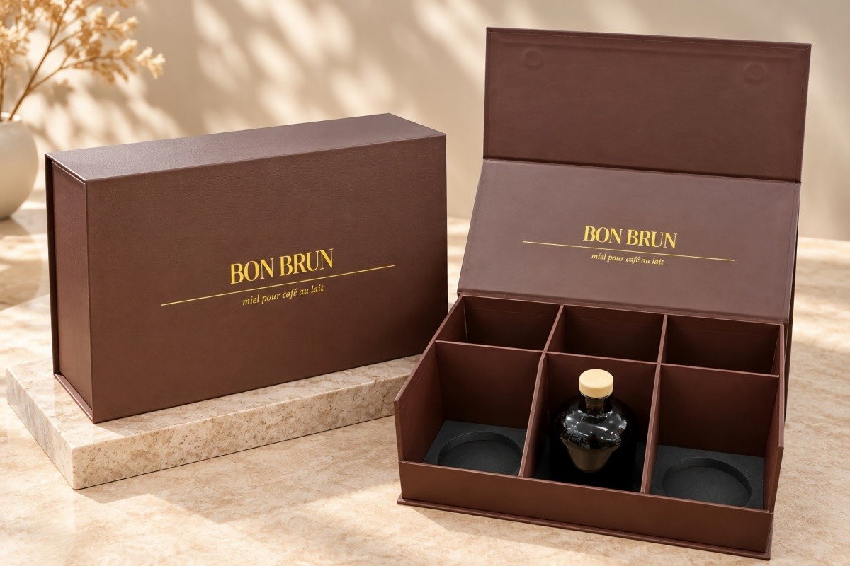 Brown six-bottle magnetic rigid liquor gift box sample with compartment dividers EVA base supports and one liquor bottle positioned inside