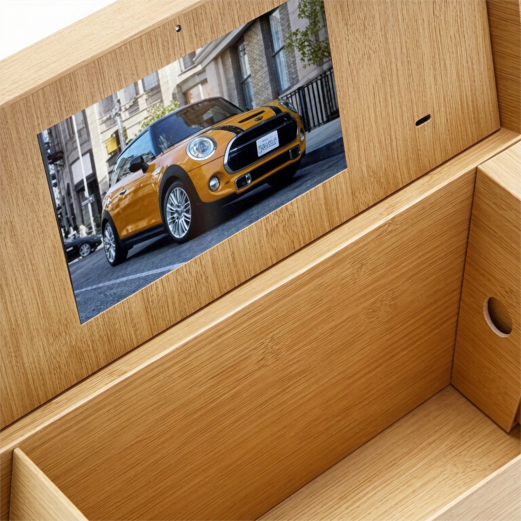 Open hinged lid whisky packaging box with built in video display
