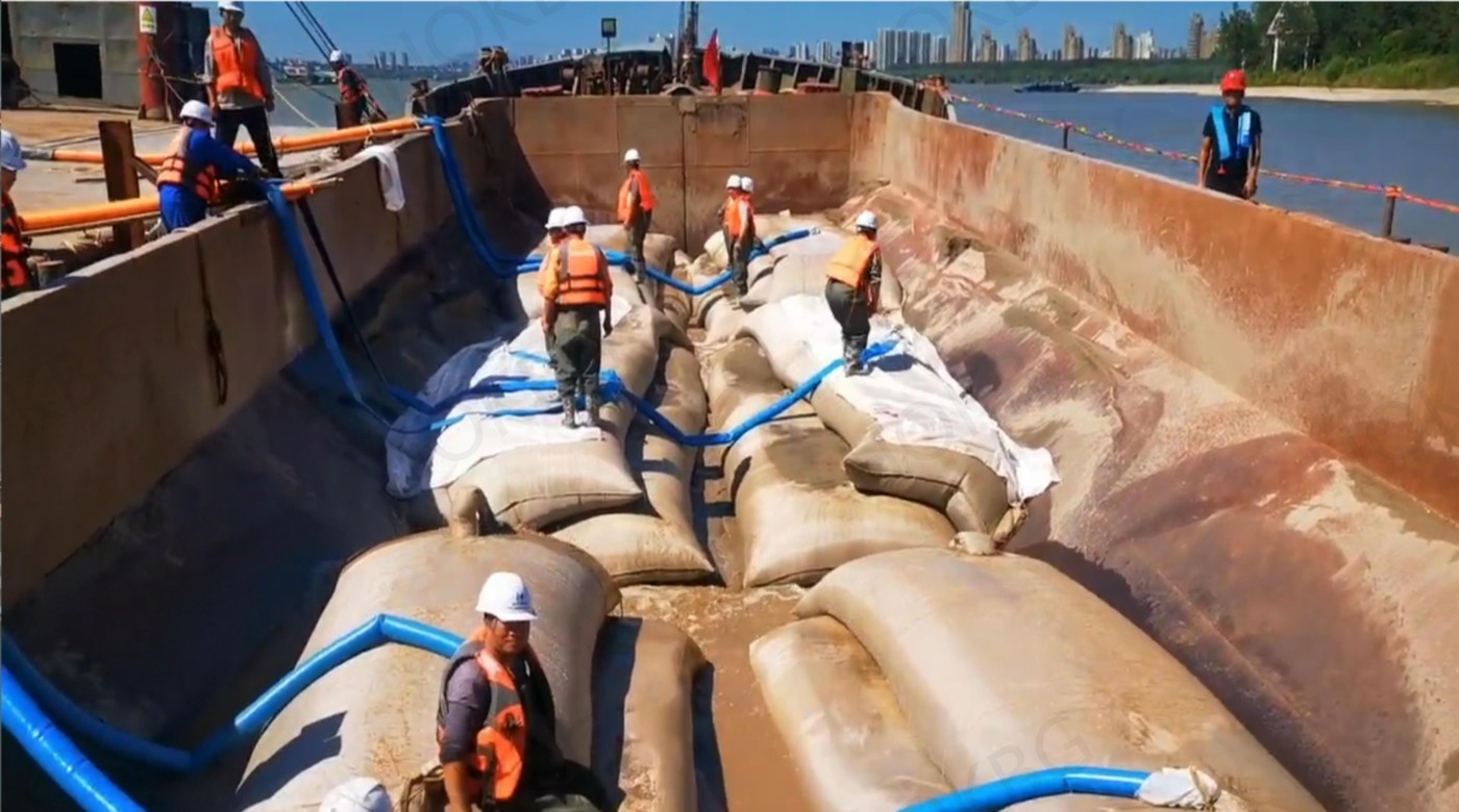 Submarine cable and pipeline protection plan uses geotextile tube bag construction