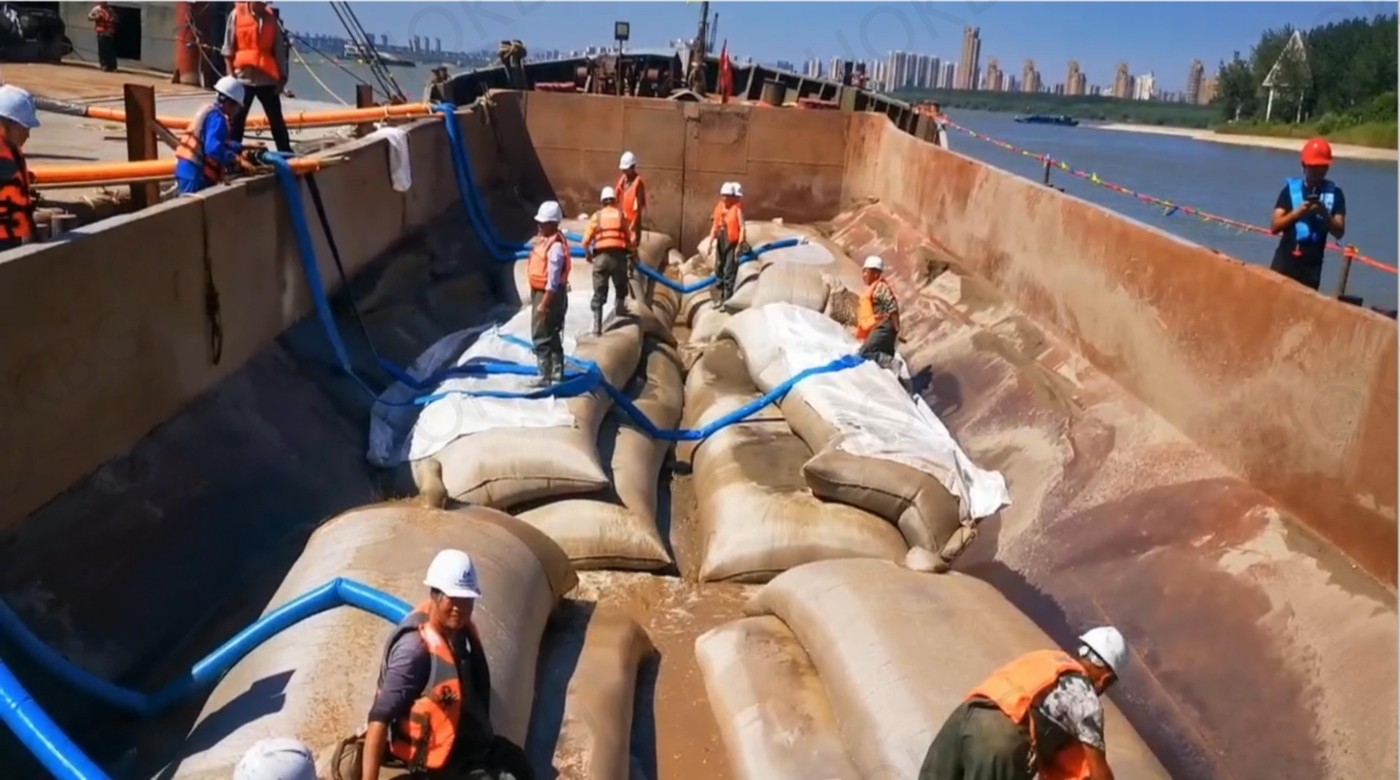 Submarine cable and pipeline protection plan uses geotextile tube bag construction