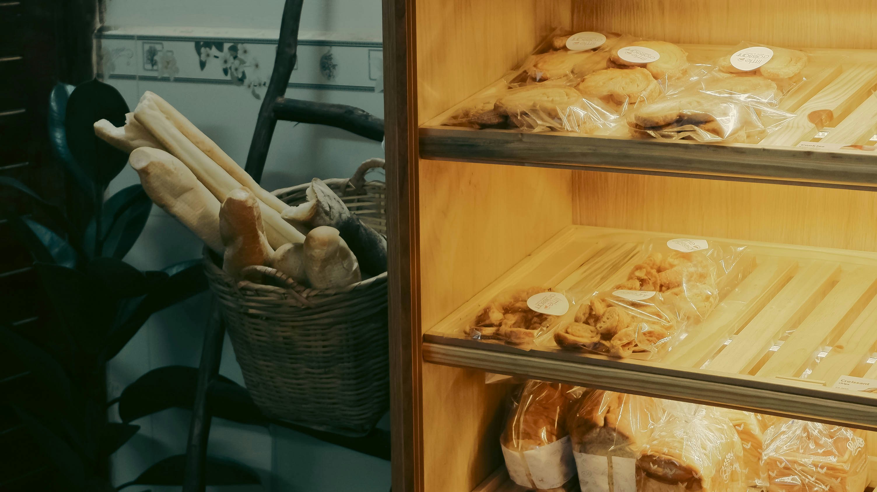 Artisan breads and pizzas from a deck oven A selection of perfectly baked artisan breads and pizzas coming out of a commercial deck oven.