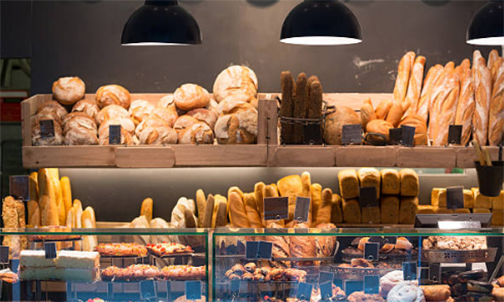 Stainless steel commercial deck oven for bakeries to bake bread, croissants, cakes, cookies, and other baked goods.