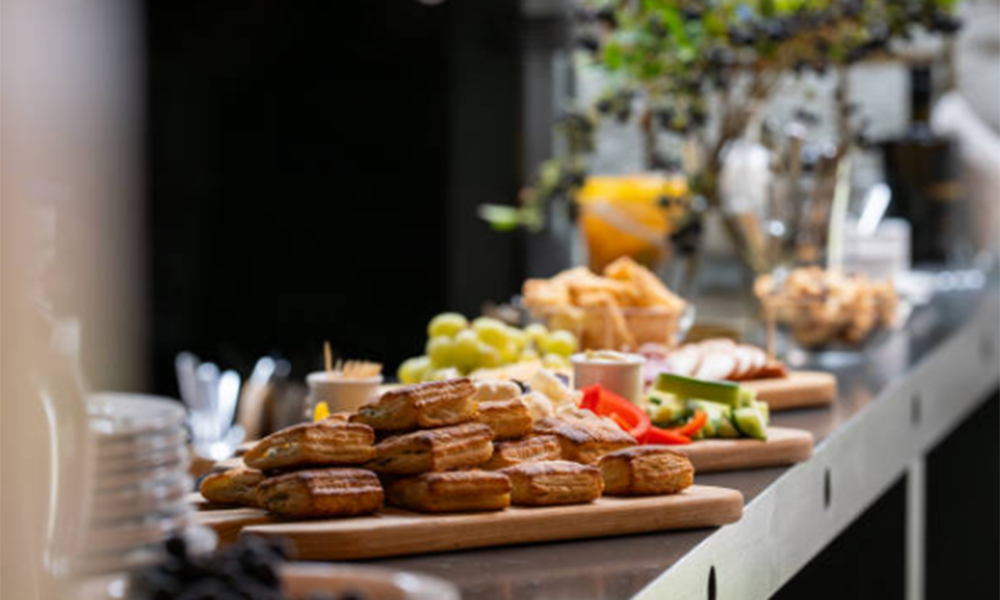 Stainless steel commercial deck oven for bakeries to bake bread, croissants, cakes, cookies, and other baked goods.