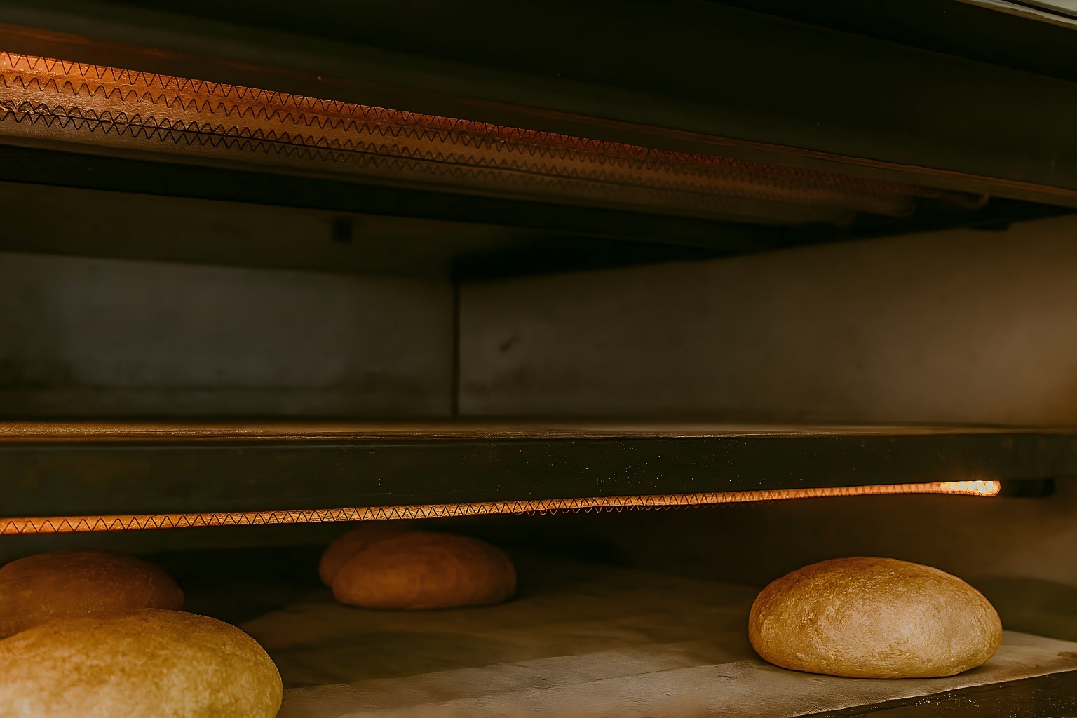 Inside view of commercial deck oven with stone deck heating elements
