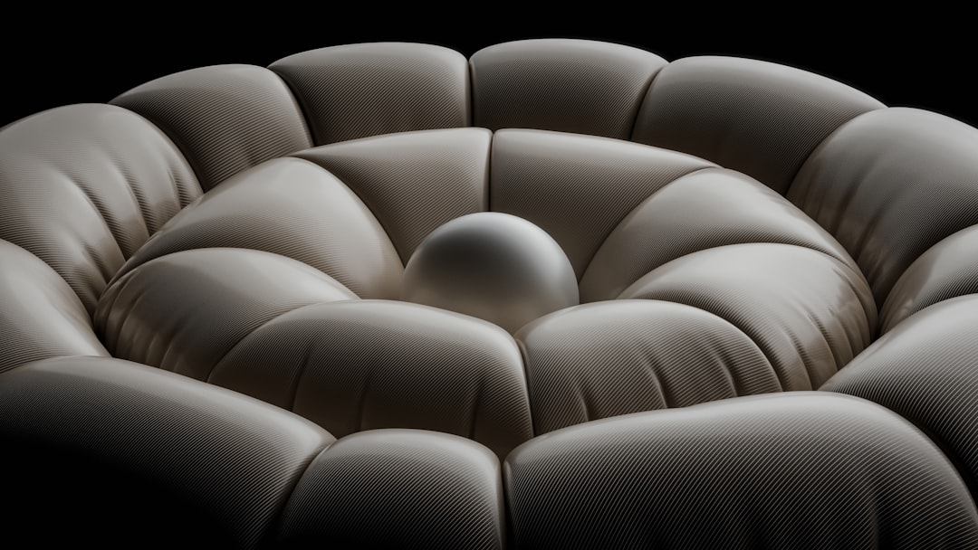 A close-up of a styled soft play sofa with elegant throws and pillows