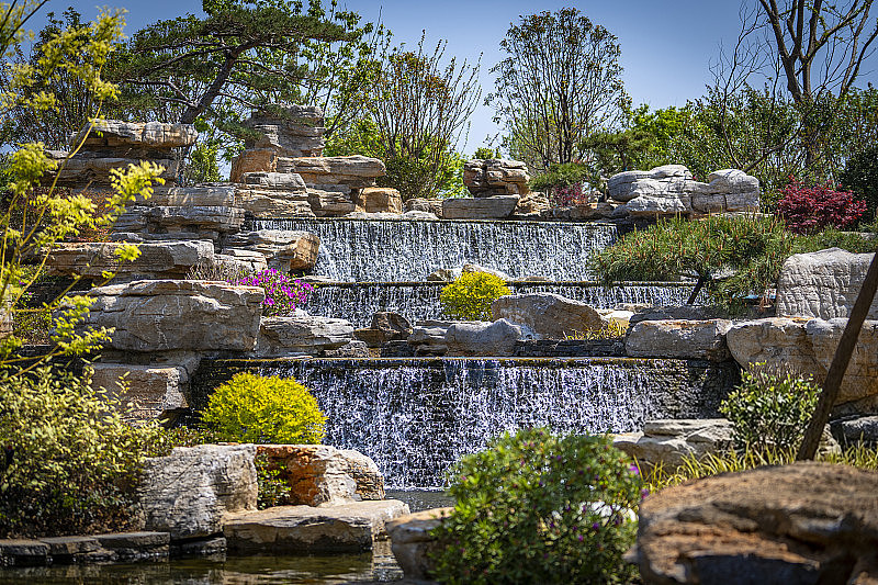 Wide multi-level landscaped pond waterfall powered by a Jinwa PPA-33000S pump in Australia