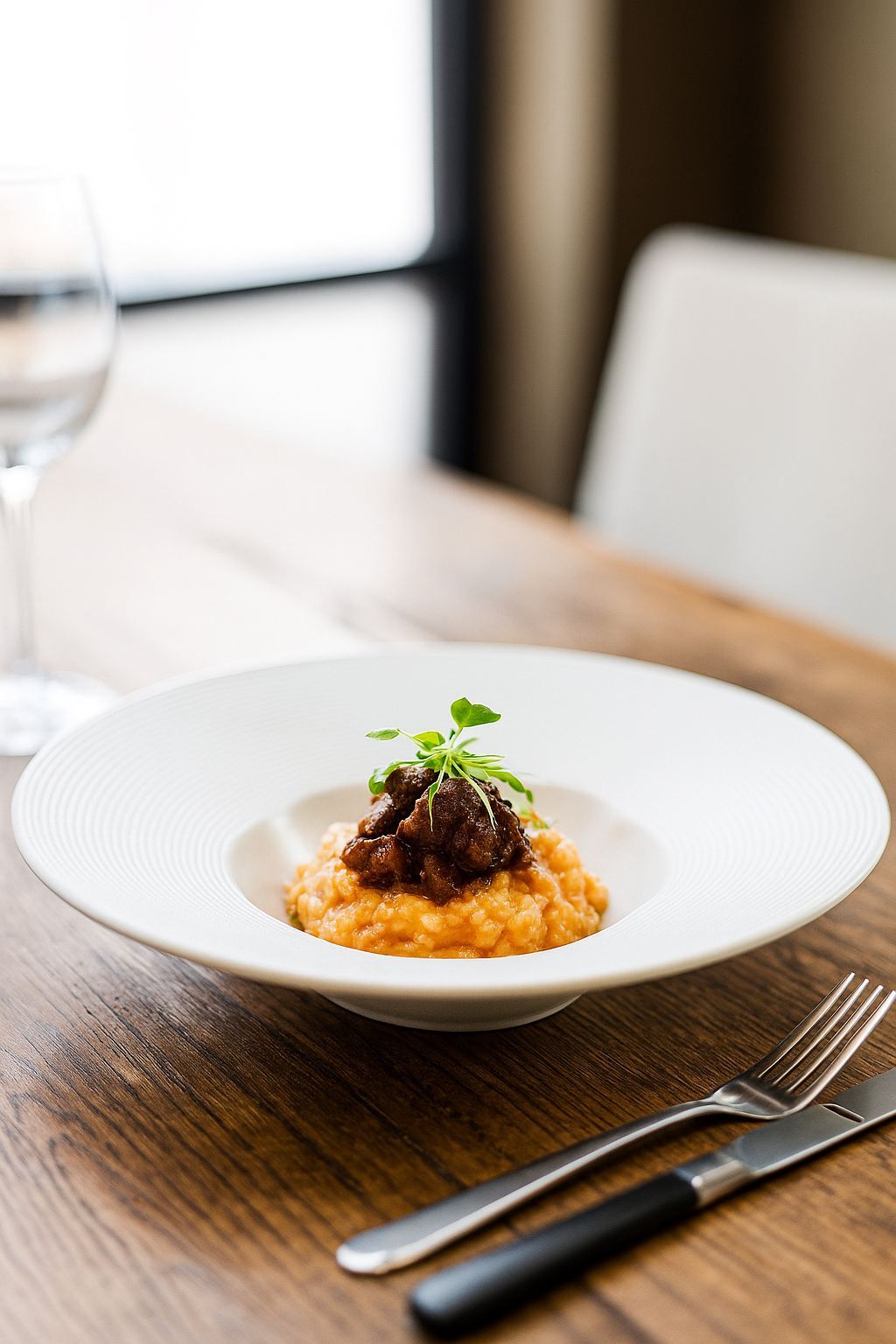 White Ceramic Deep Dish Pasta Plate in Fine Dining Restaurant, Holding Sauced Pasta for Gourmet Presentation