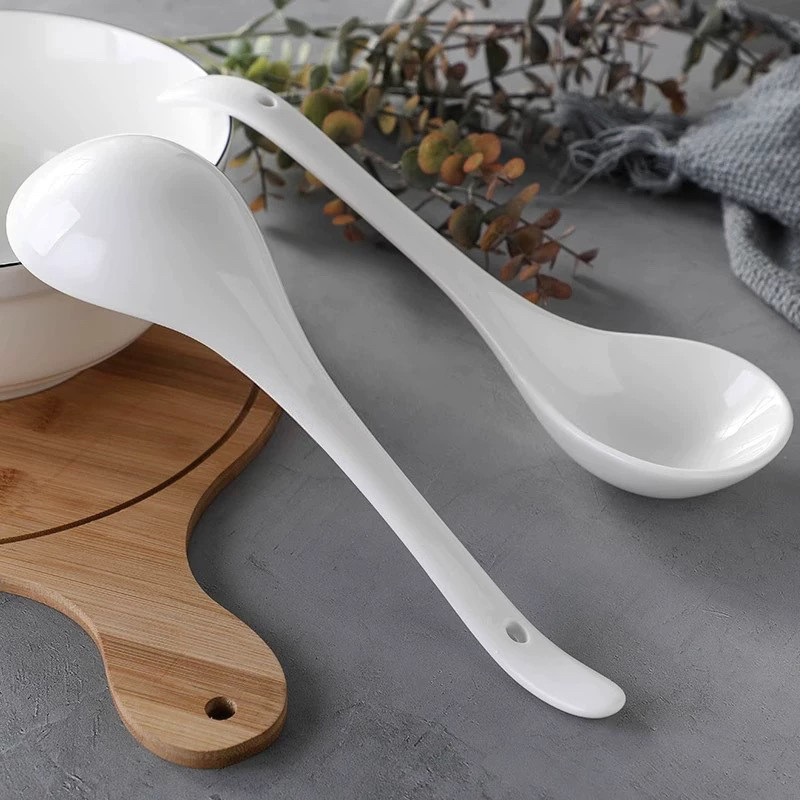 Front & Back View Of White Ceramic Spoon