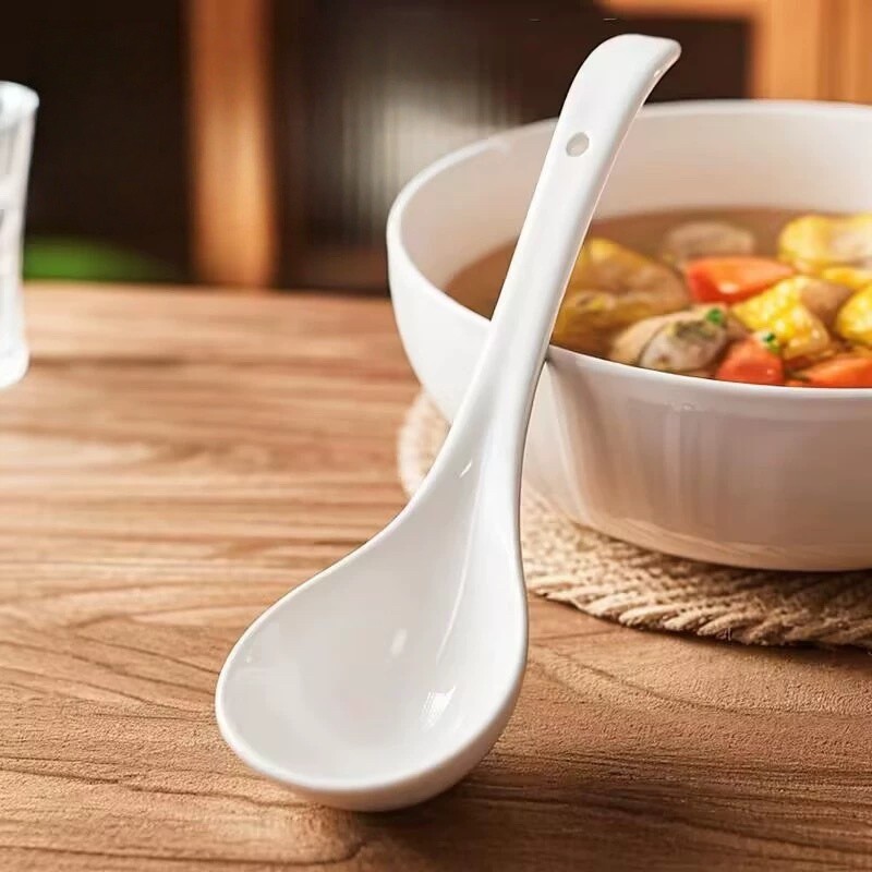 White Ceramic Spoon In Kitchen Usage Scene 