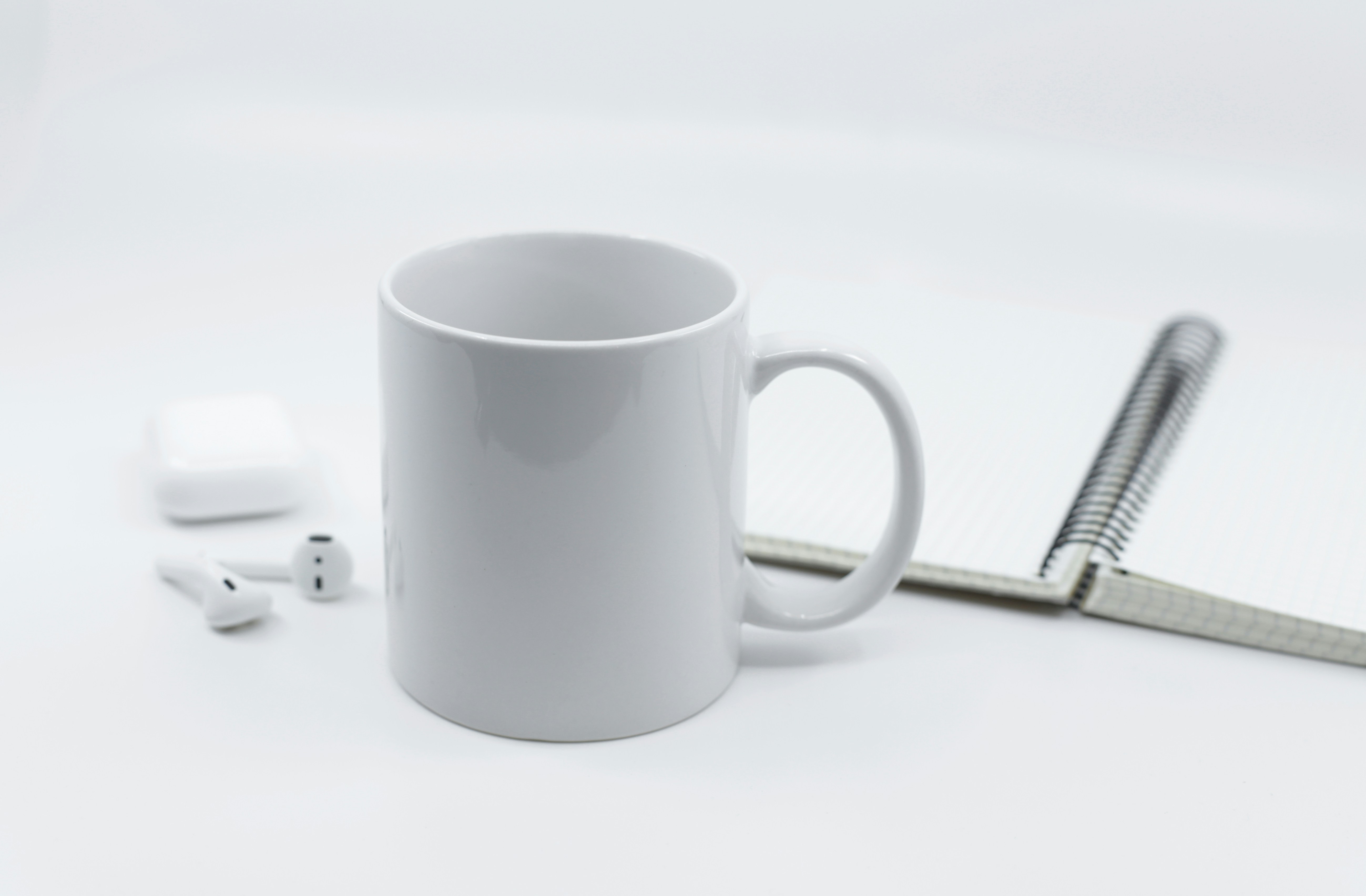 A close-up shot showing the smooth, glossy polymer coating on a high-quality sublimation mug blank.