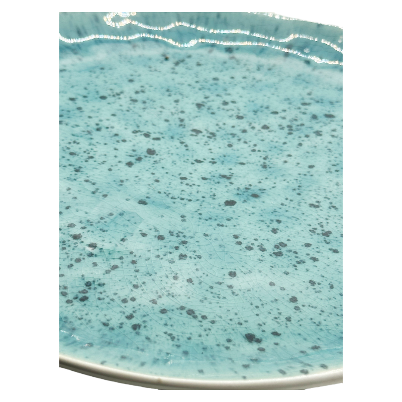 Close-Up Detail View of Blue Crystalline Glaze on Nordic Style Handmade Stoneware Ceramic Dinner Plate Surface