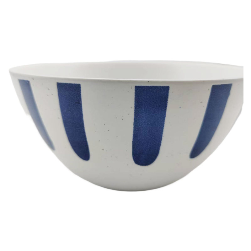 Close-up of blue brushstroke pattern on matte stoneware bowl