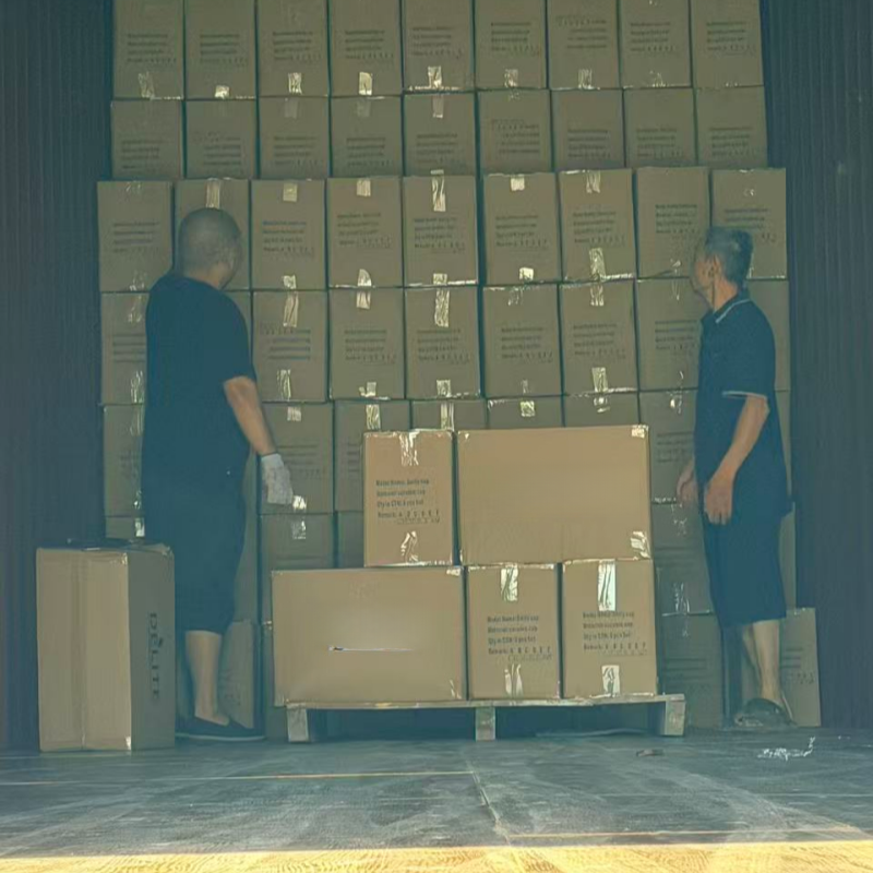 A factory worker inspecting the quality of newly made ceramic plates.