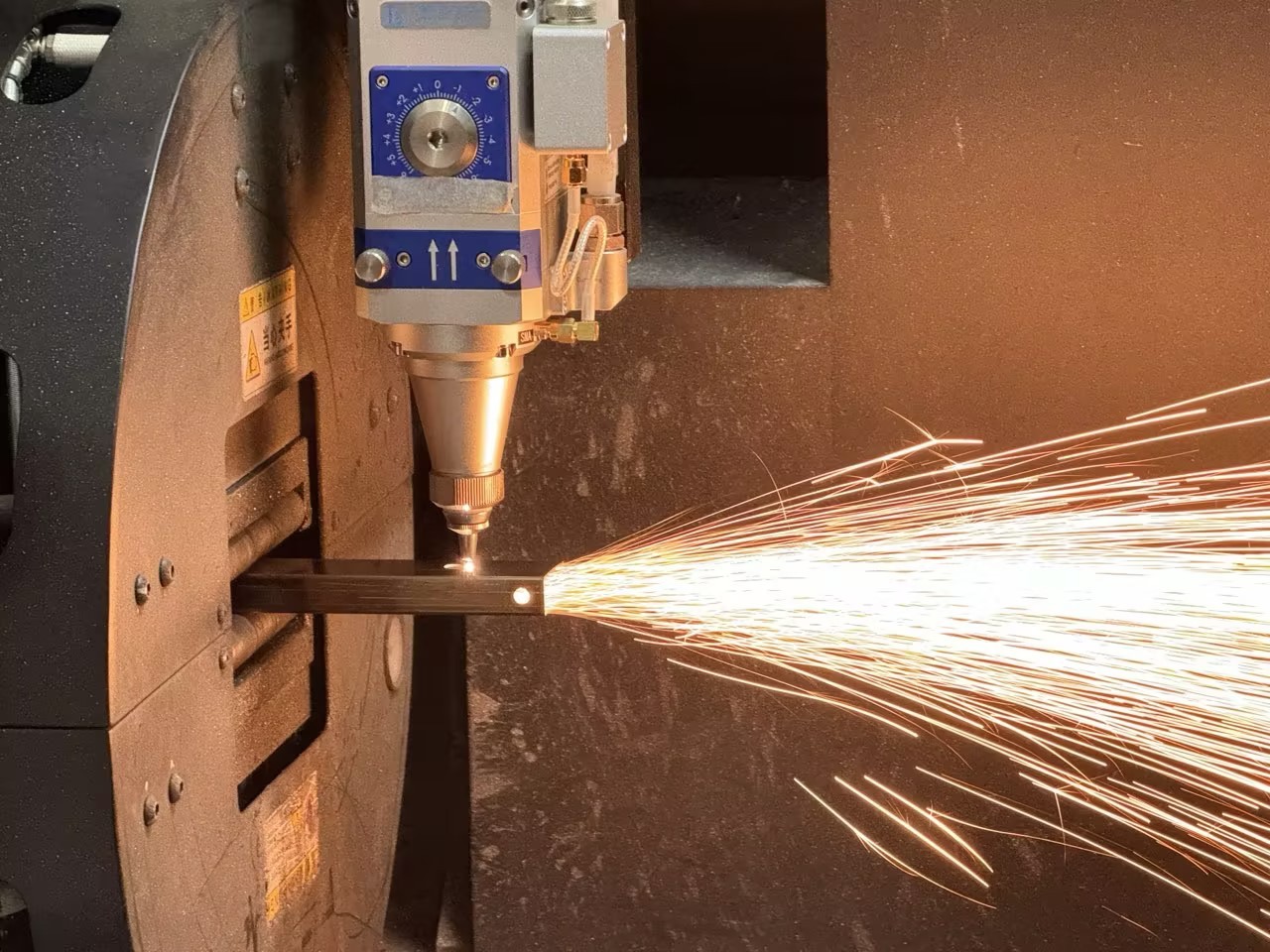 A row of cafe umbrellas with bright, colorful patterns and branding.