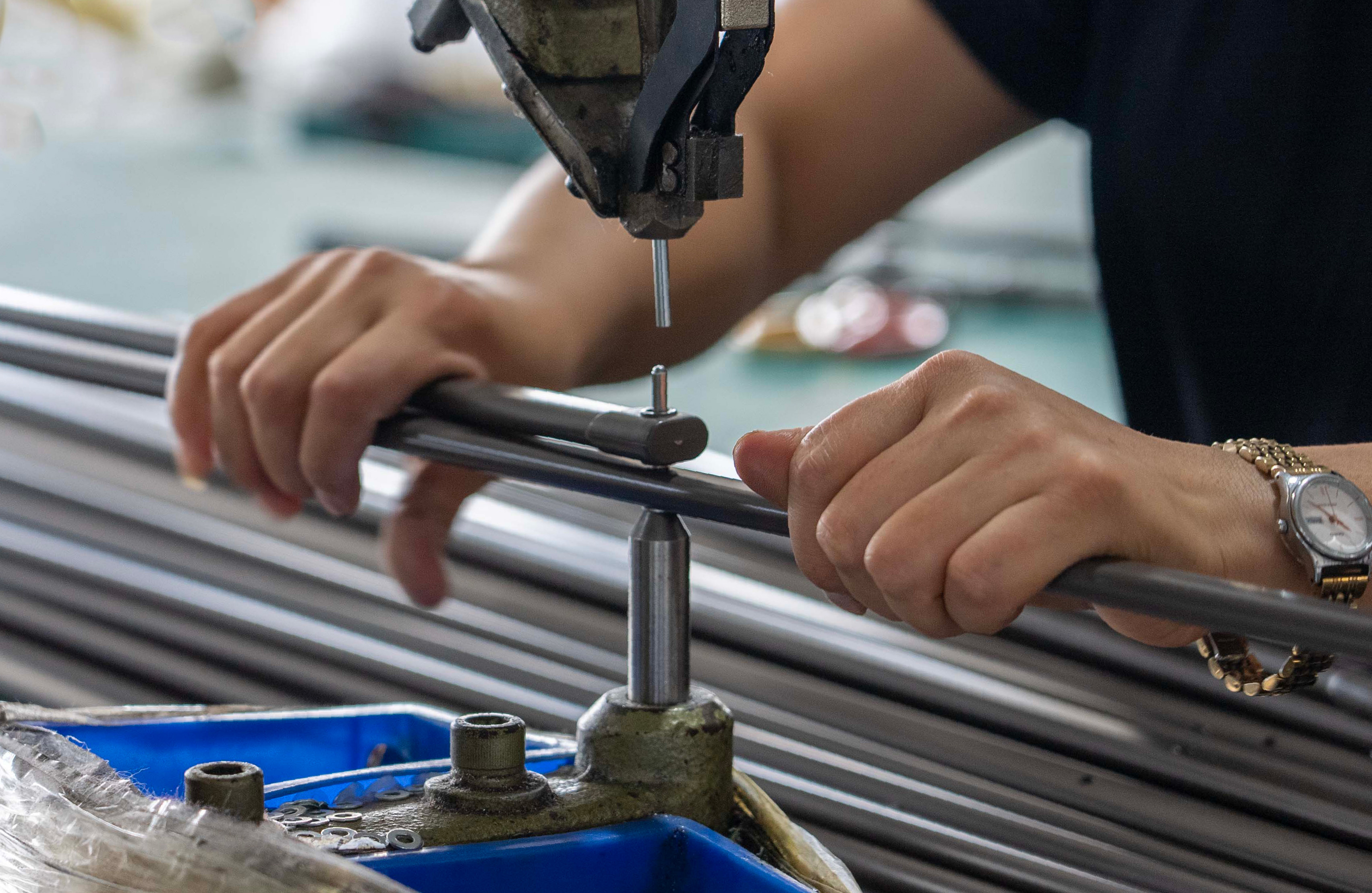 A broken and discarded patio umbrella frame lying on the ground.