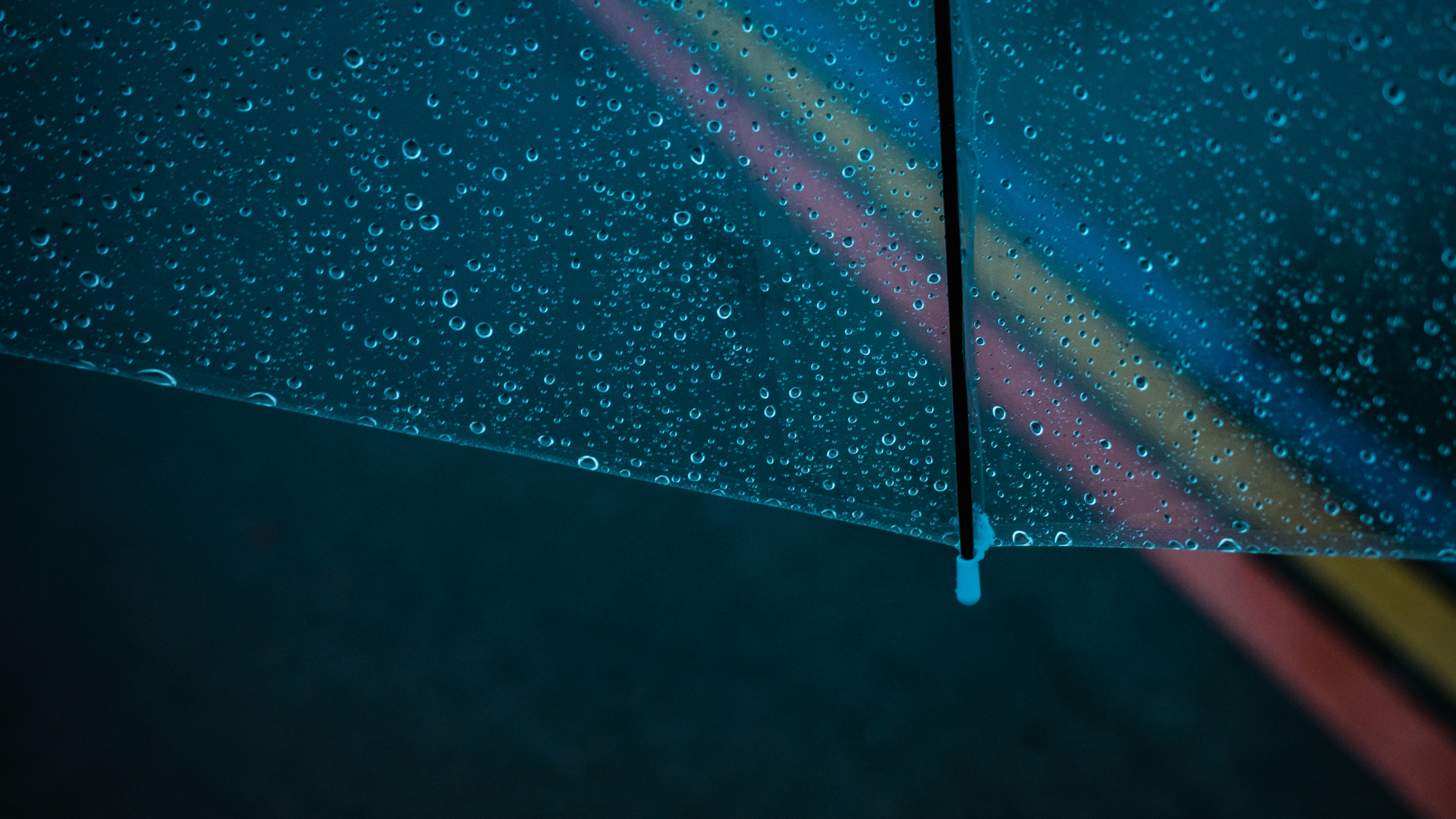 Close-up shot of water beading on a polyester umbrella canopy.