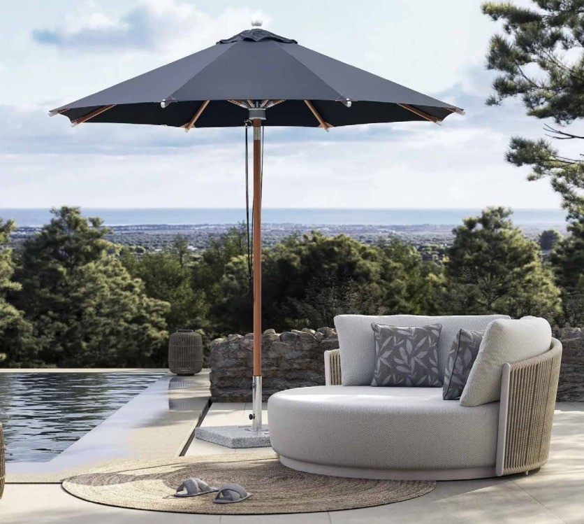 FHUM069 commercial center pole umbrella by Foris Hortus installed beside a resort pool