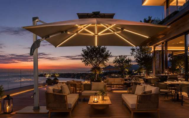 FHUM099 cantilever umbrella on a sea-view restaurant terrace at sunset