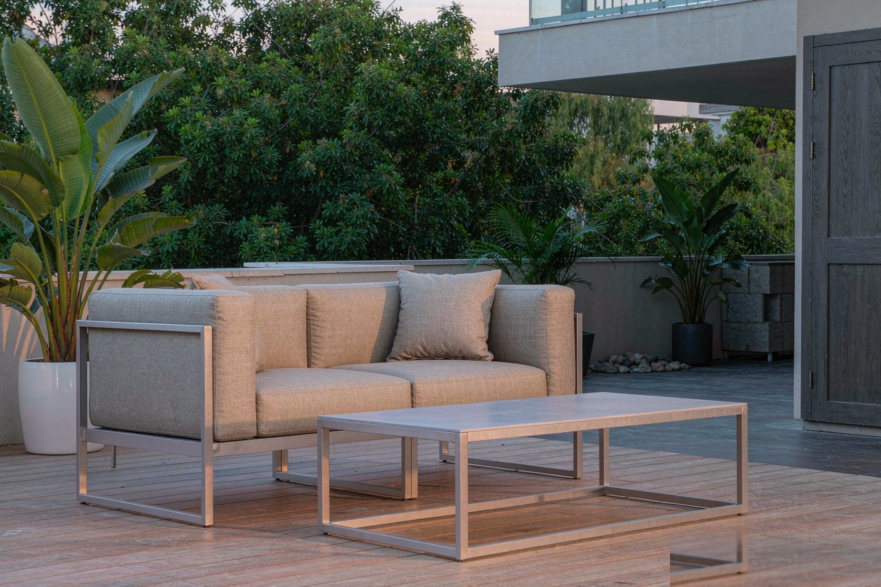 Foris Hortus aluminium outdoor sofa set styled on a modern terrace at golden hour