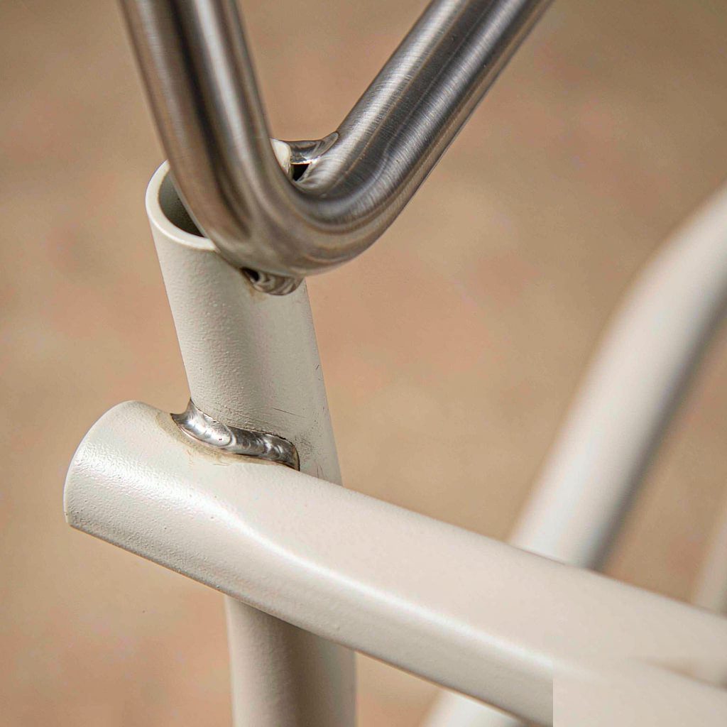 Close-up of a welded, powder-coated aluminium frame joint on an outdoor sofa
