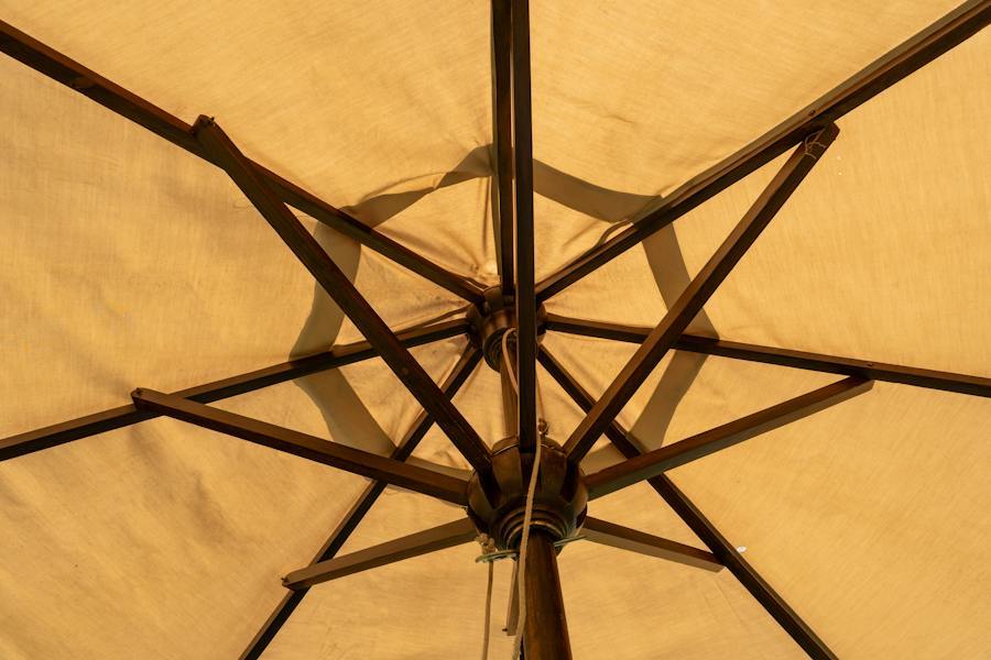 View from below of an umbrella frame with eight ribs radiating from the hub