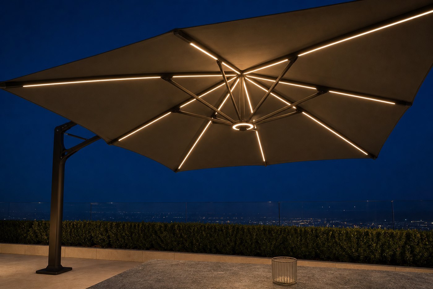 LED strips recessed along the underside of an outdoor umbrella's ribs, lit at dusk