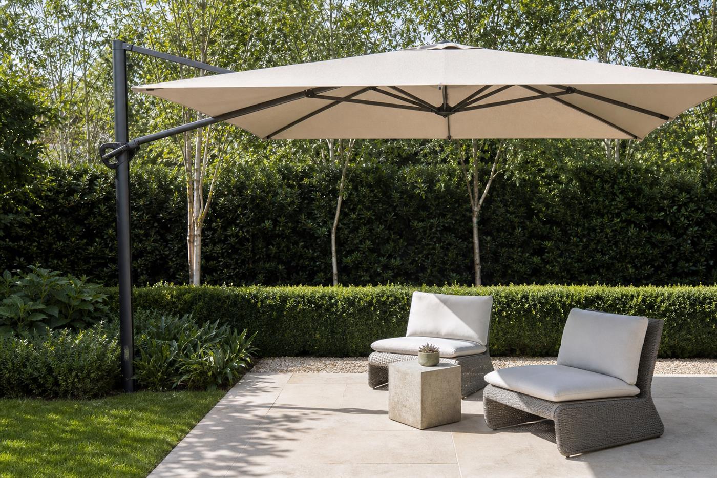 Cantilever umbrella swung out over a garden lounge group with its upright in the planted border