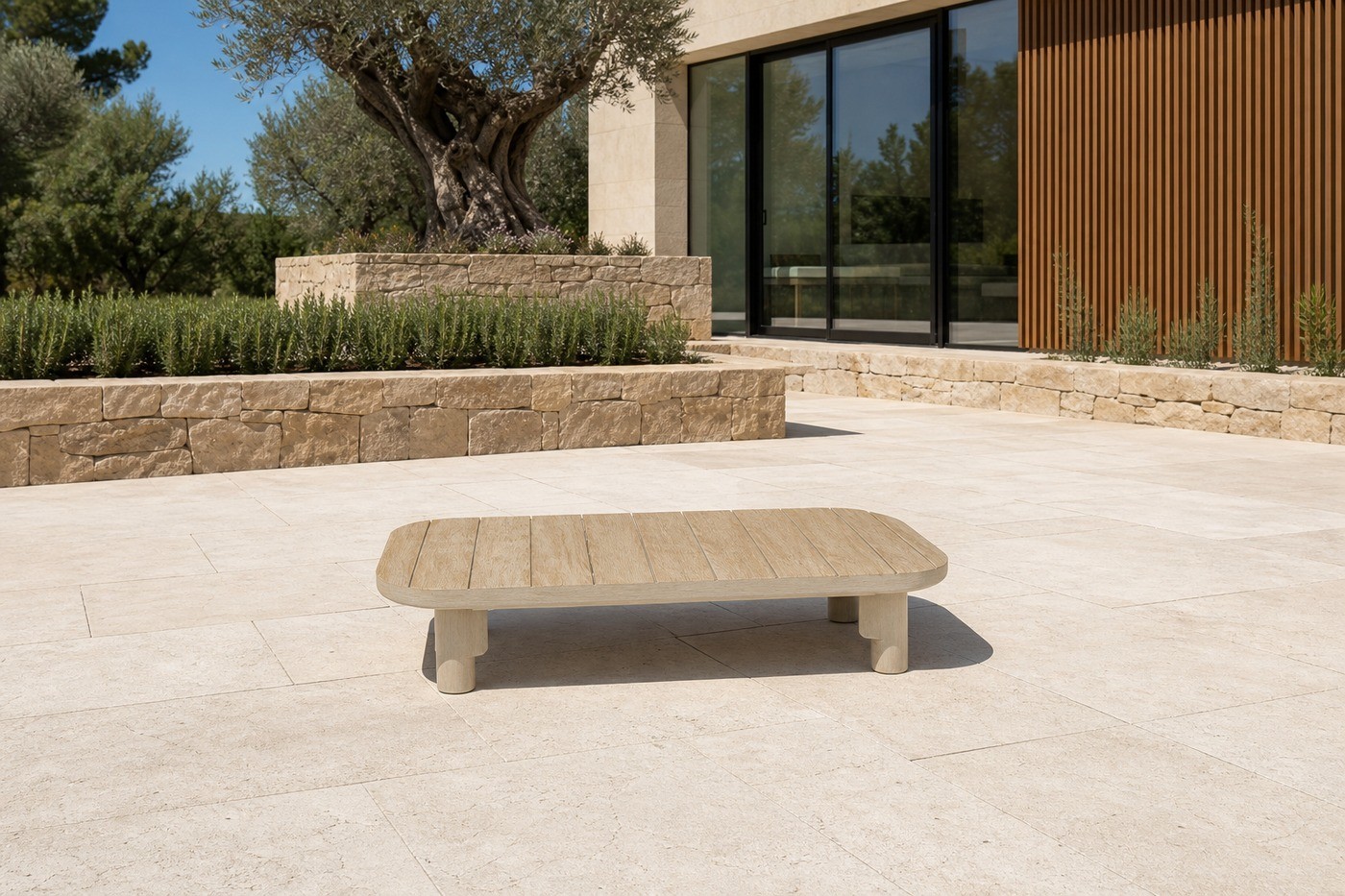 Curved modular sofa set on a stone villa terrace with an olive tree planter