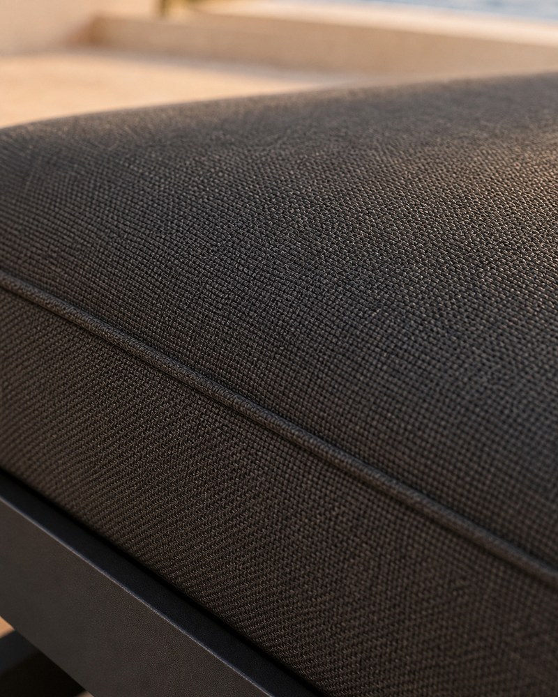 Grey polyester cushion fabric with woven texture and piping on the aluminium frame