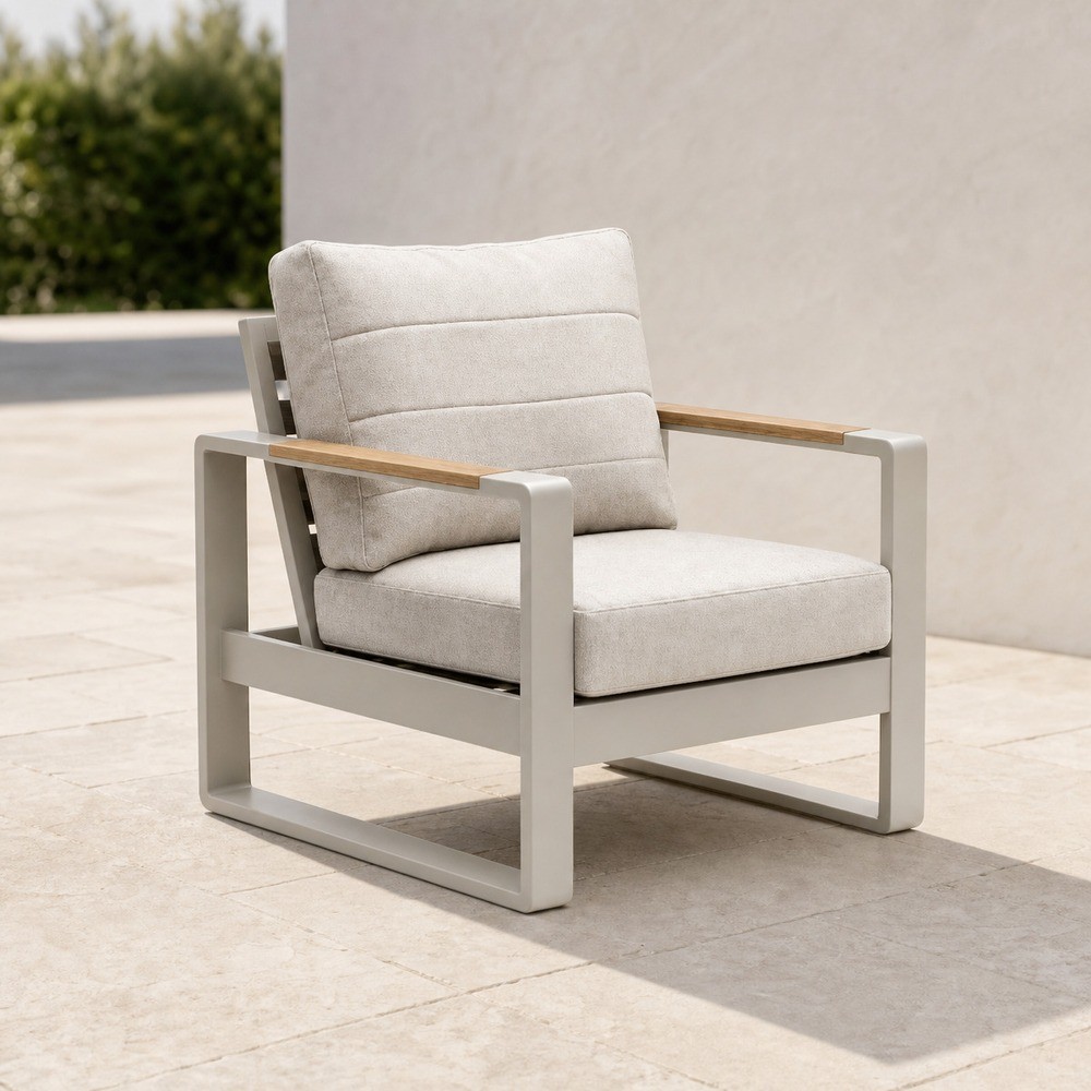 Single aluminium outdoor lounge chair with wood armrests and cream cushion