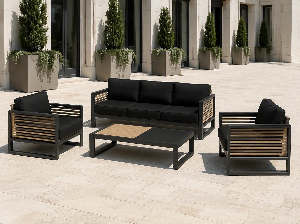 Charcoal aluminium outdoor sofa set with wood-slat panels on a wide hotel terrace of pale travertine