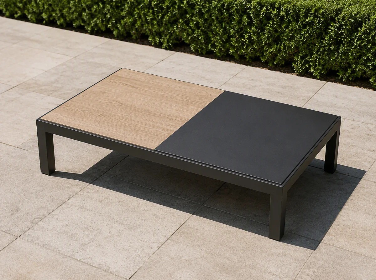 Low outdoor coffee table on a charcoal aluminium frame with a top split half in light wood grain and half in dark charcoal