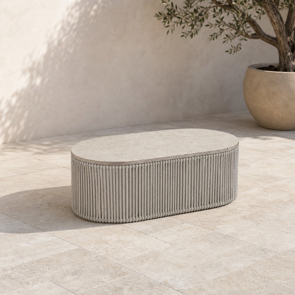 Oval coffee table with a sintered stone top over a braided base
