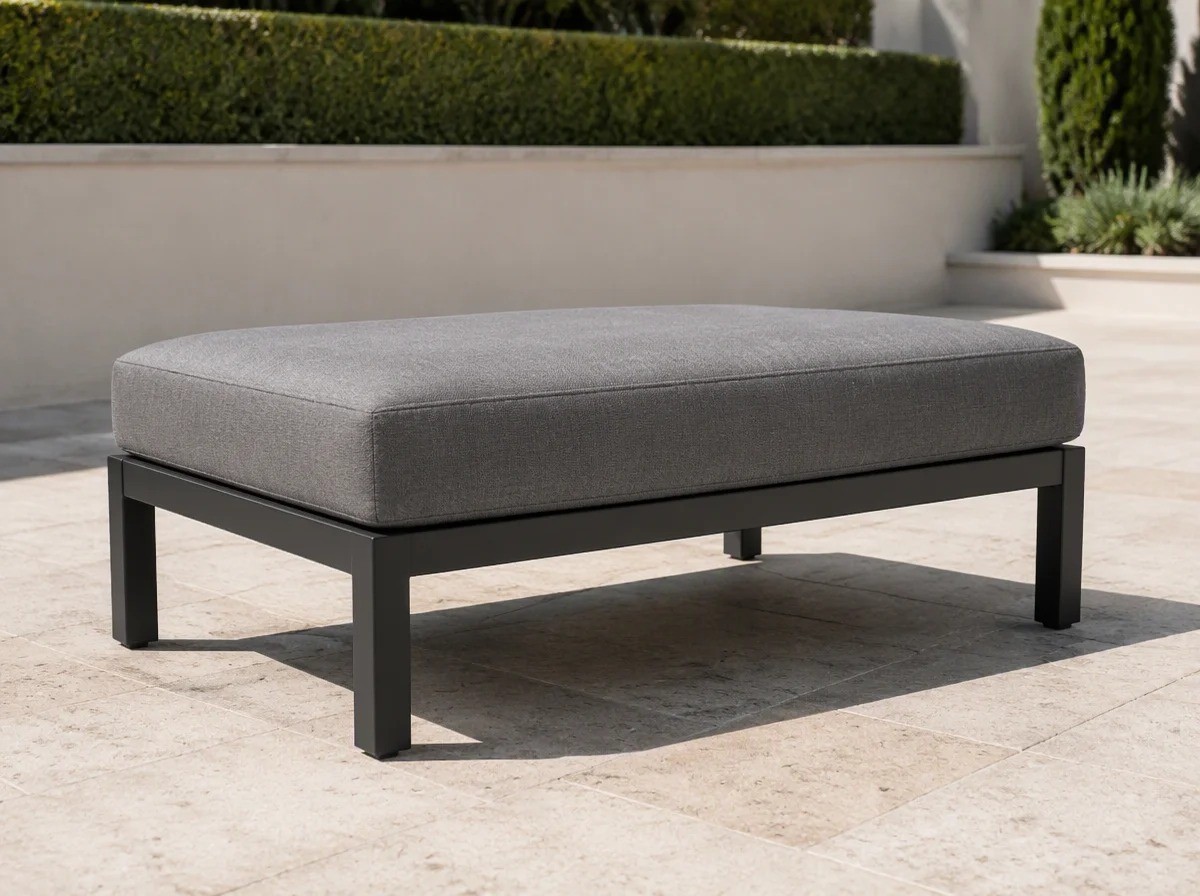 Armless outdoor sofa: a backless upholstered grey seat pad on a charcoal aluminium frame