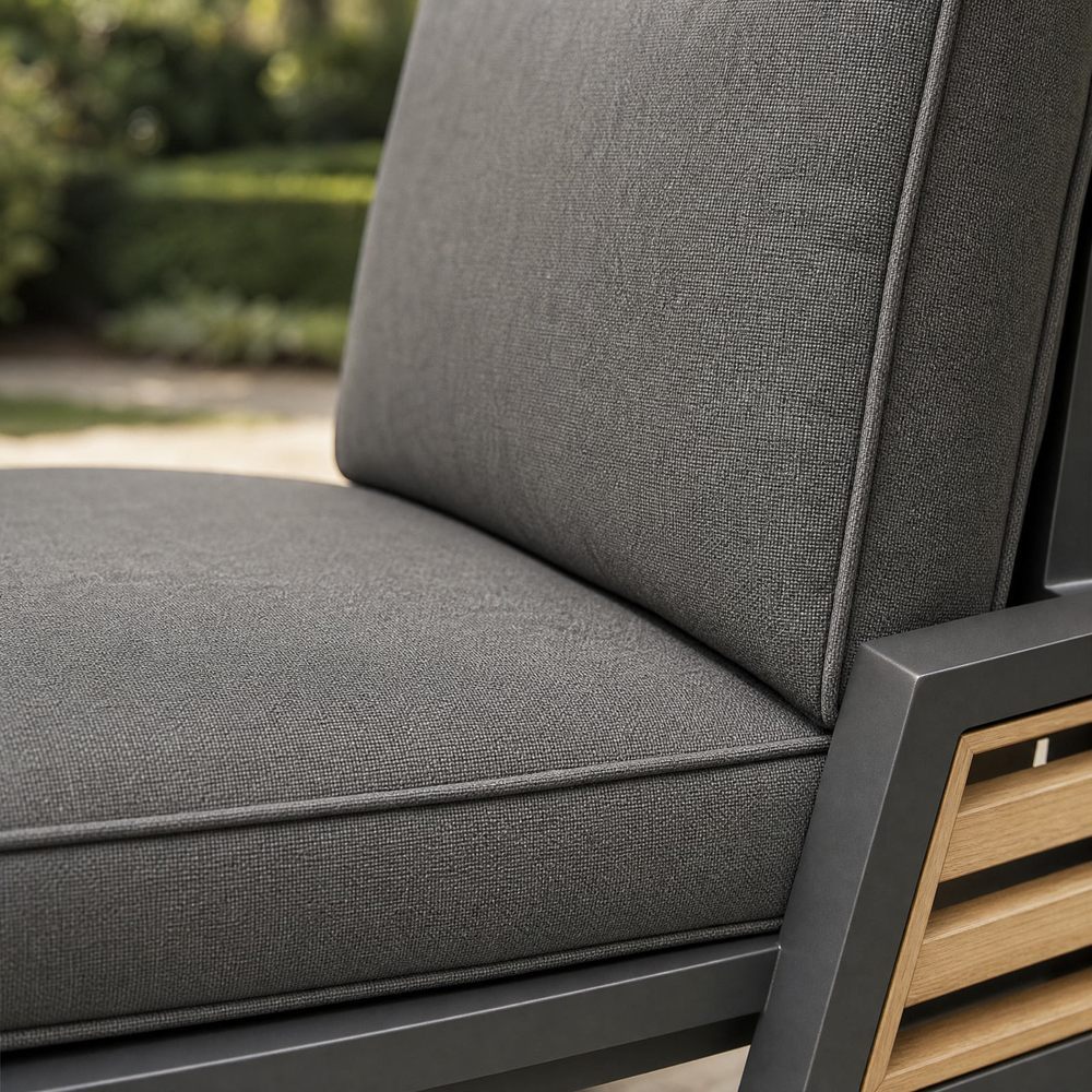 Grey cushioned seat and back with piped edges
