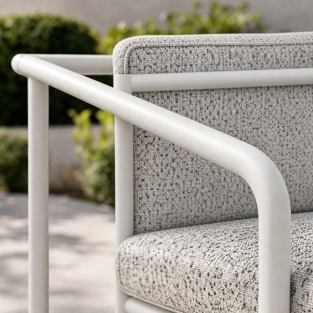 White round tube armrest sloping down to the front leg