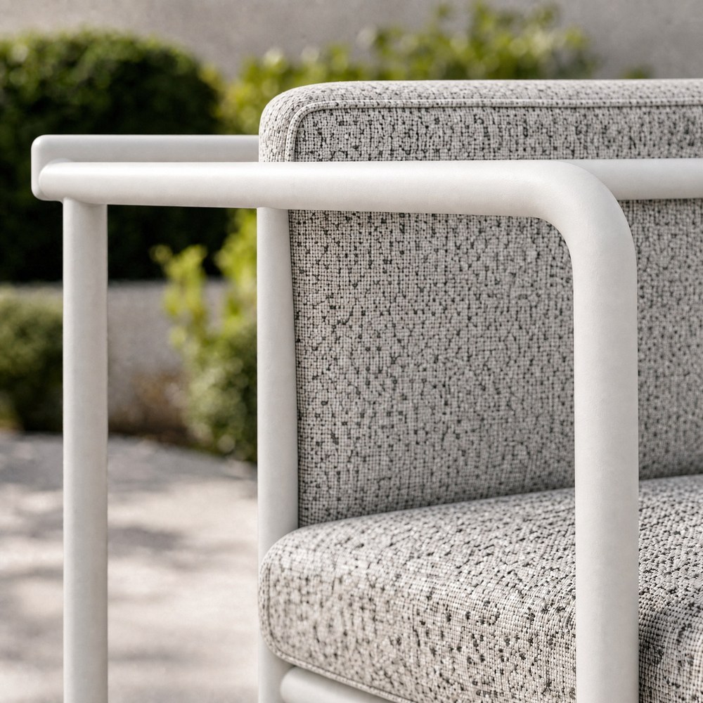 White round tube armrest sloping down to the front leg
