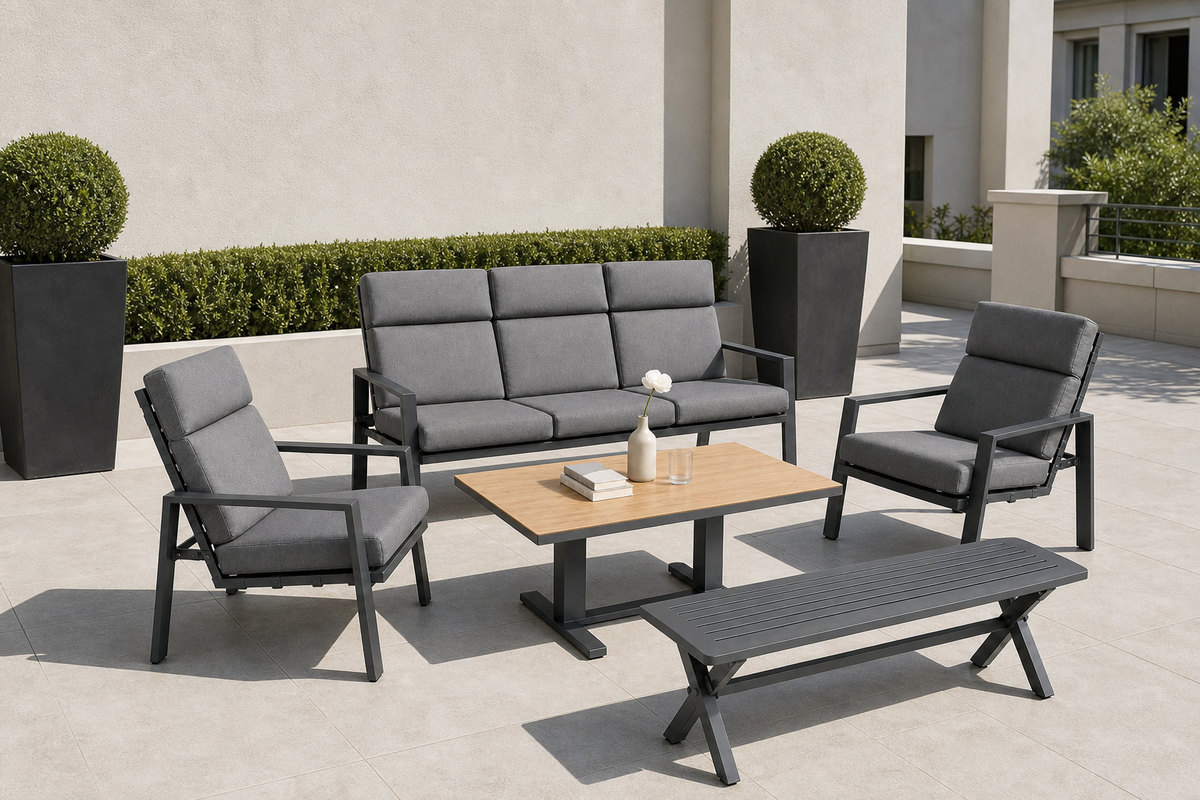 Outdoor sofa set on a hotel terrace with a three-seat sofa, two lounge armchairs, a low coffee table and a slatted bench