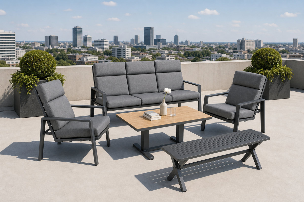 Outdoor sofa set with a three-seat sofa, two lounge armchairs, a pale-topped low table and a slatted bench on a rooftop terrace above a city skyline