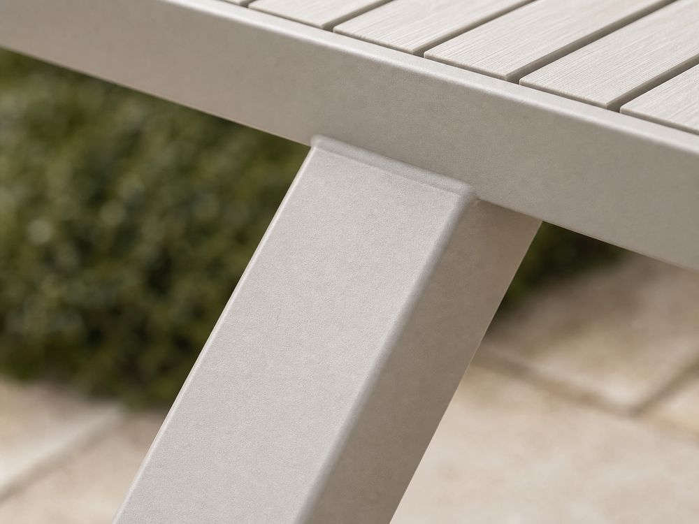 Close-up of an aluminium square tube frame joint and base connection on an outdoor chair